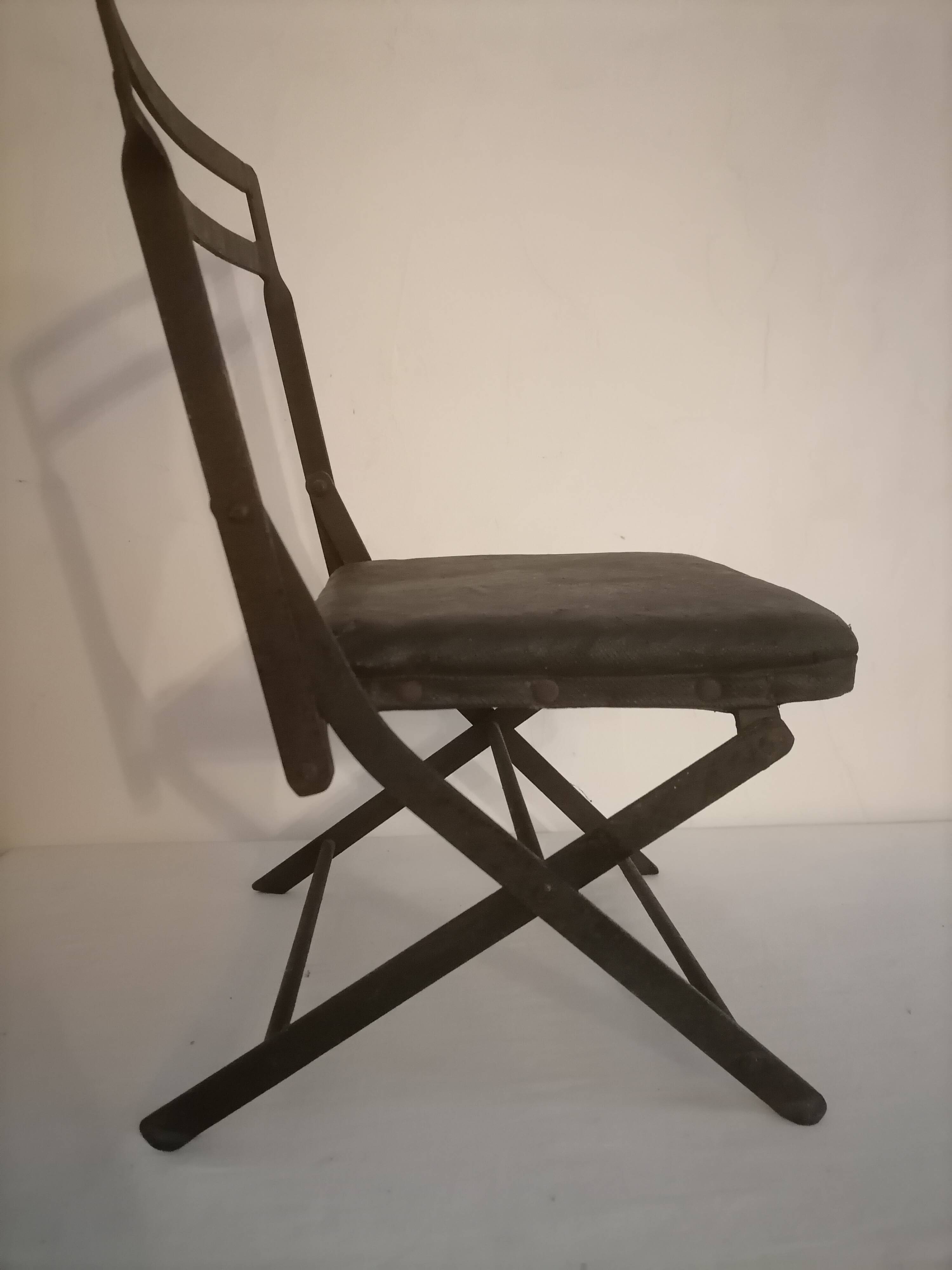 Old wrought iron folding children's chair. Early 20th century.