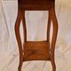 Antique Art Nouveau pedestal table with carved wood and marble top.