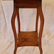 Antique Art Nouveau pedestal table with carved wood and marble top.