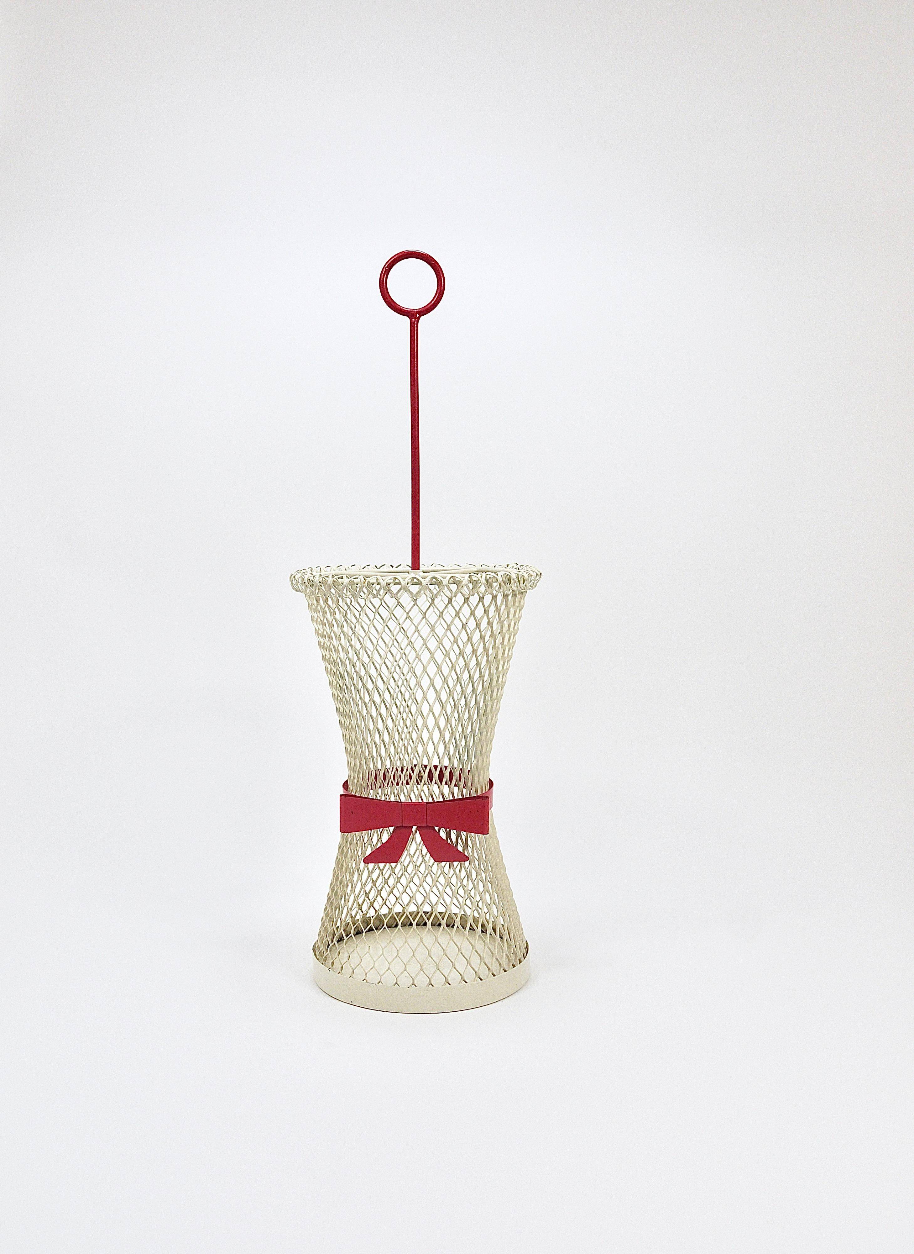 Bow tie umbrella stand in the style of Mathieu Matégot, mid-century, metal, France, 1950s.