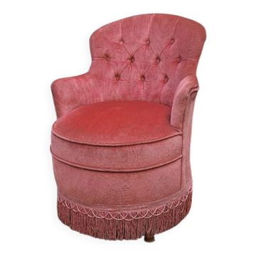 Old pink velvet armchair