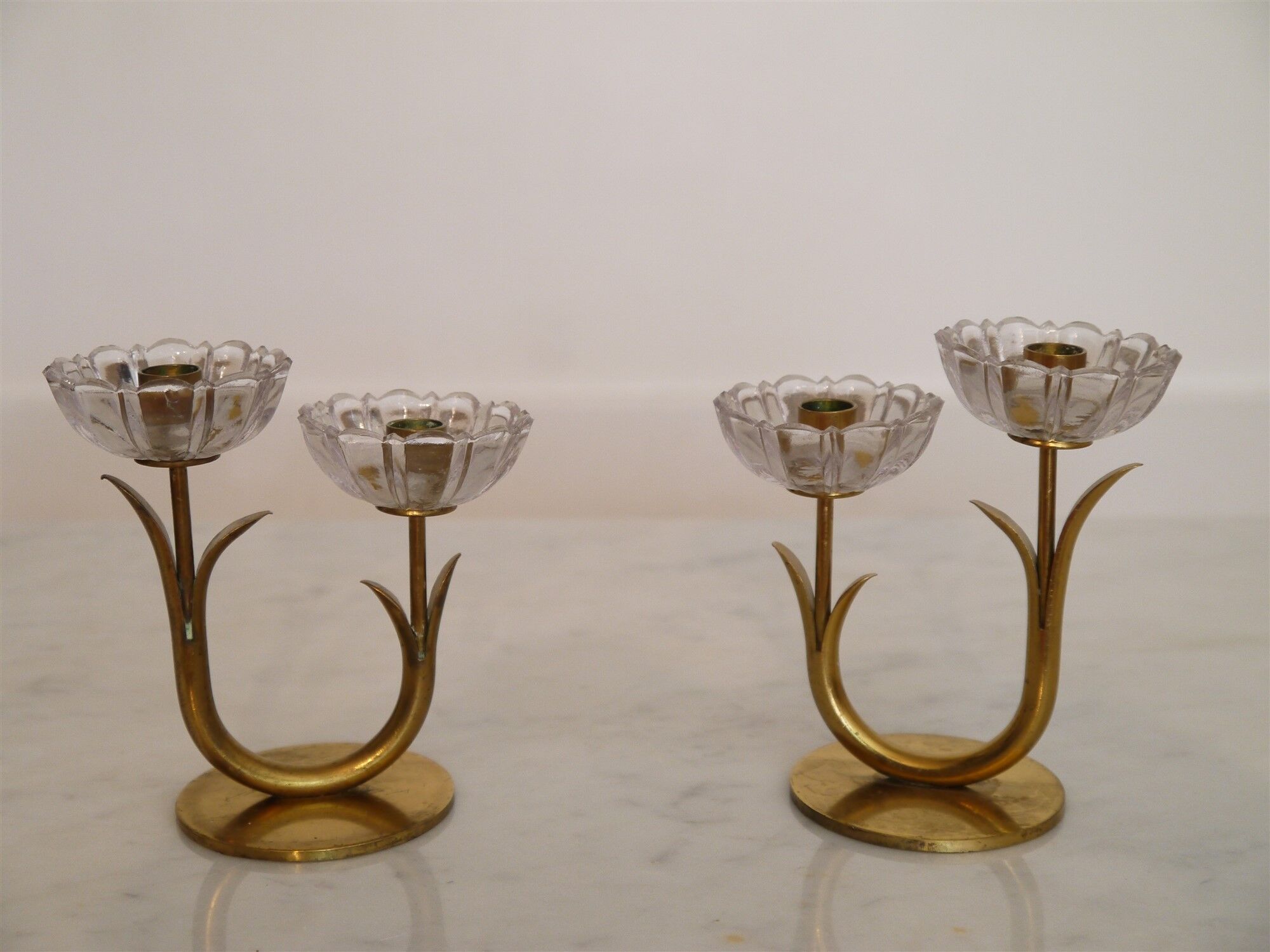 Pair of Scandinavian candlesticks made of brass and glass