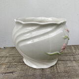 White ceramic pot cache in old flower slip