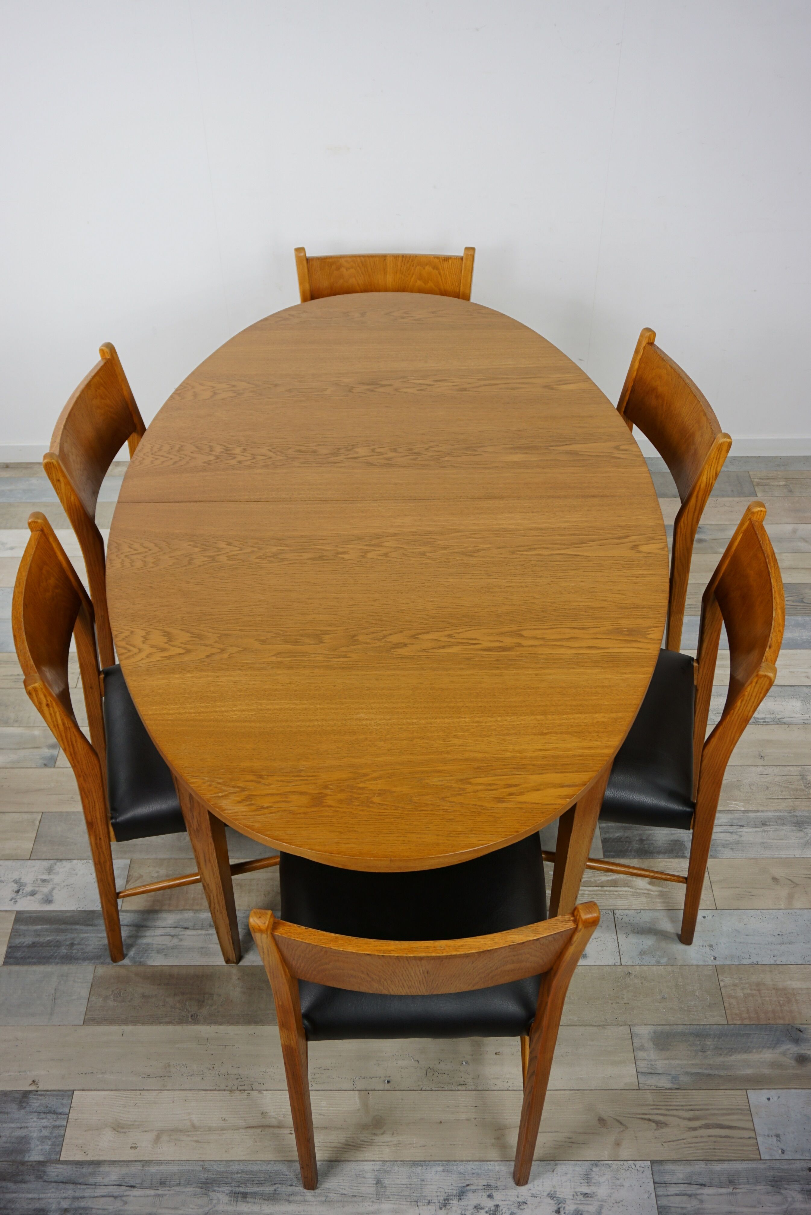 Wooden oval table and 6 matching chairs 60
