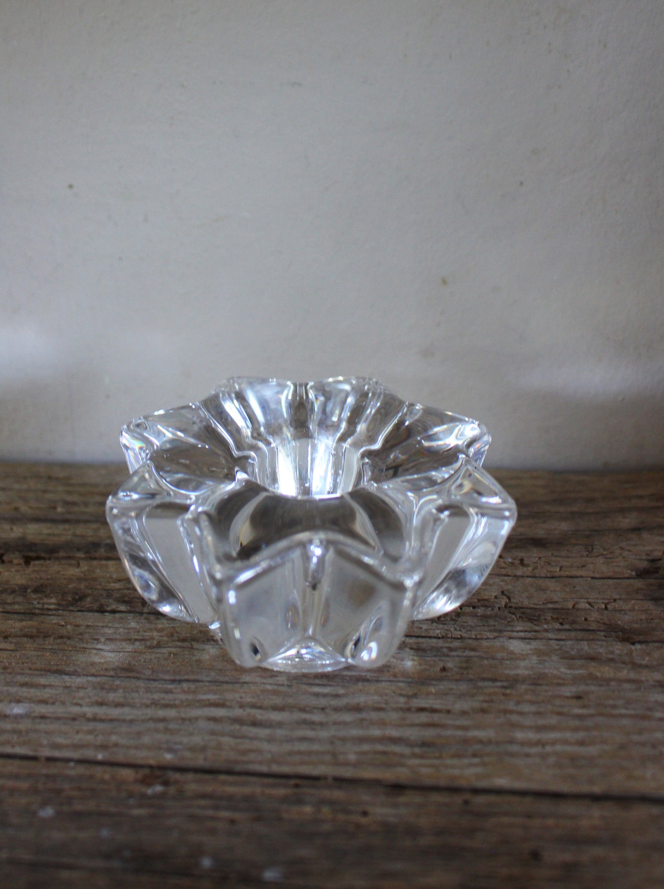 A vintage star flower glass candlestick.