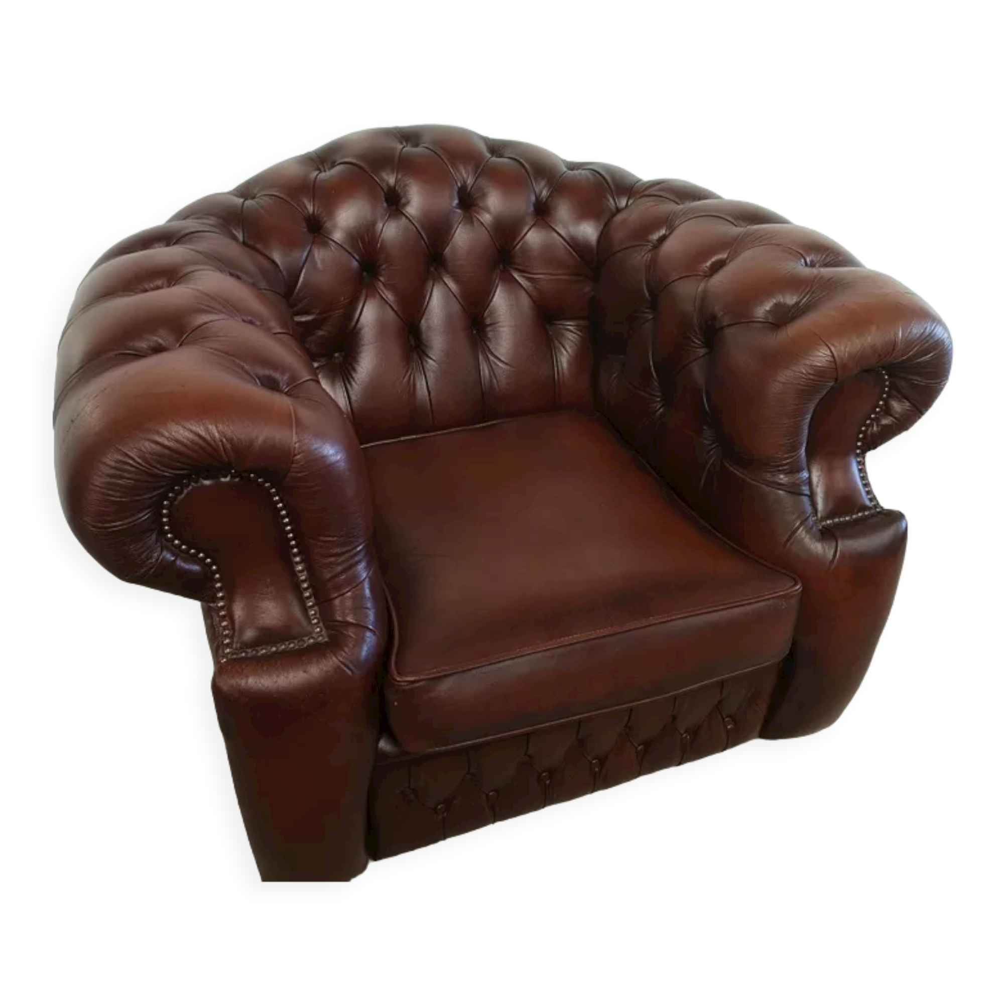 Curved brown leather chesterfield armchair