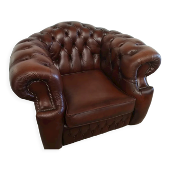 Curved brown leather chesterfield armchair