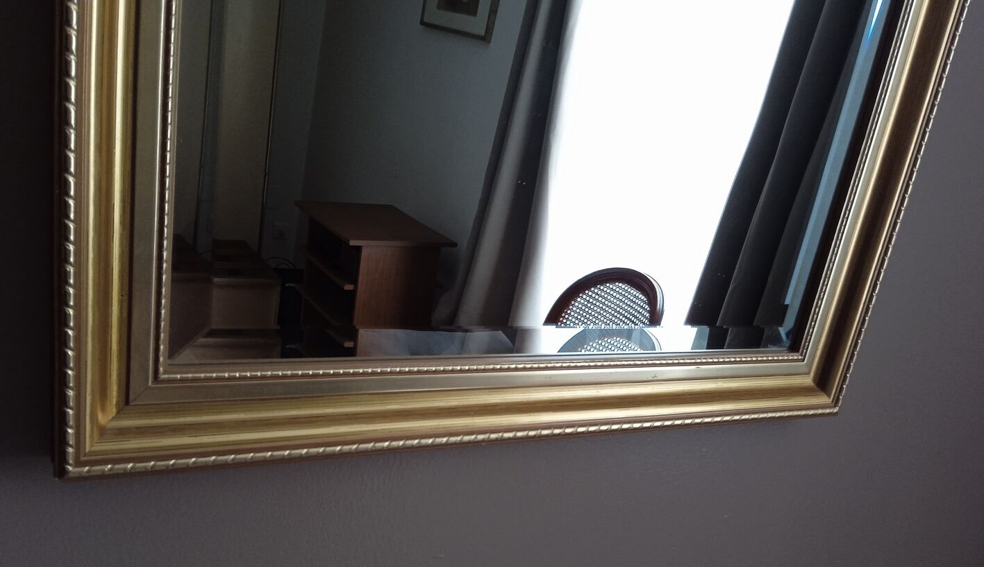 Beveled mirror with gold frame 60 x 80 cm