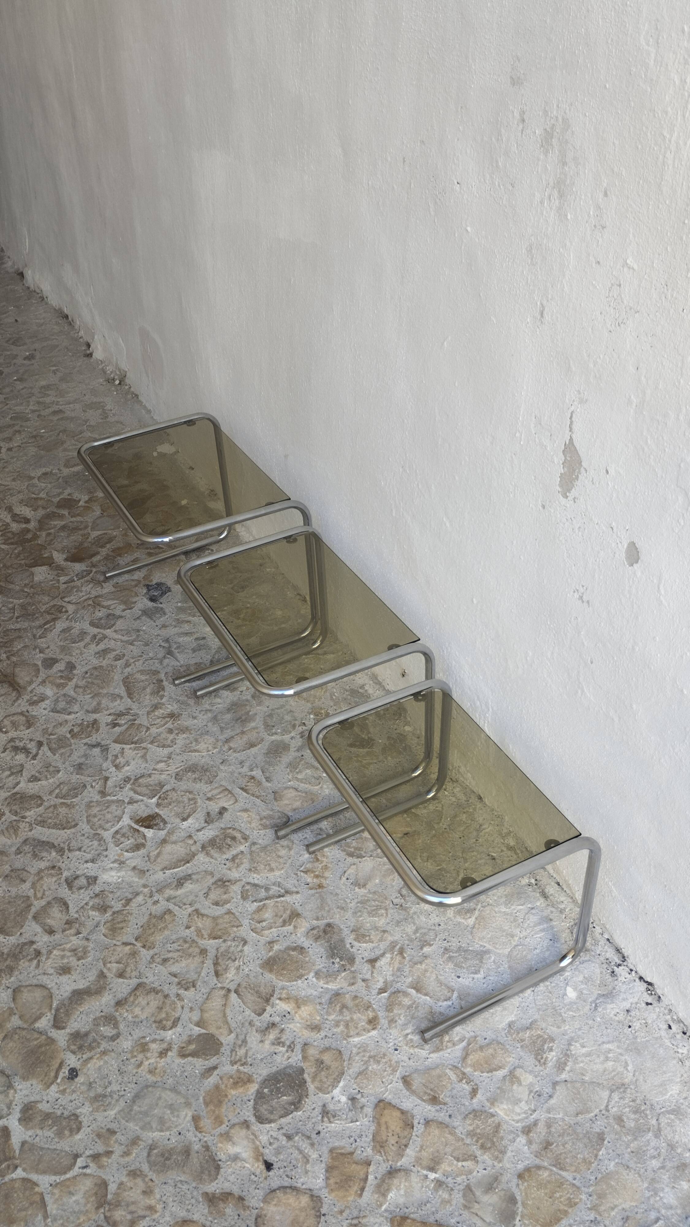 Nesting tables in chrome and smoked glass from the 70s