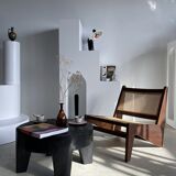 Reclined armchair in canned teak in natural wood