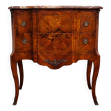 Louis XV style commode with a projection in marquetry.