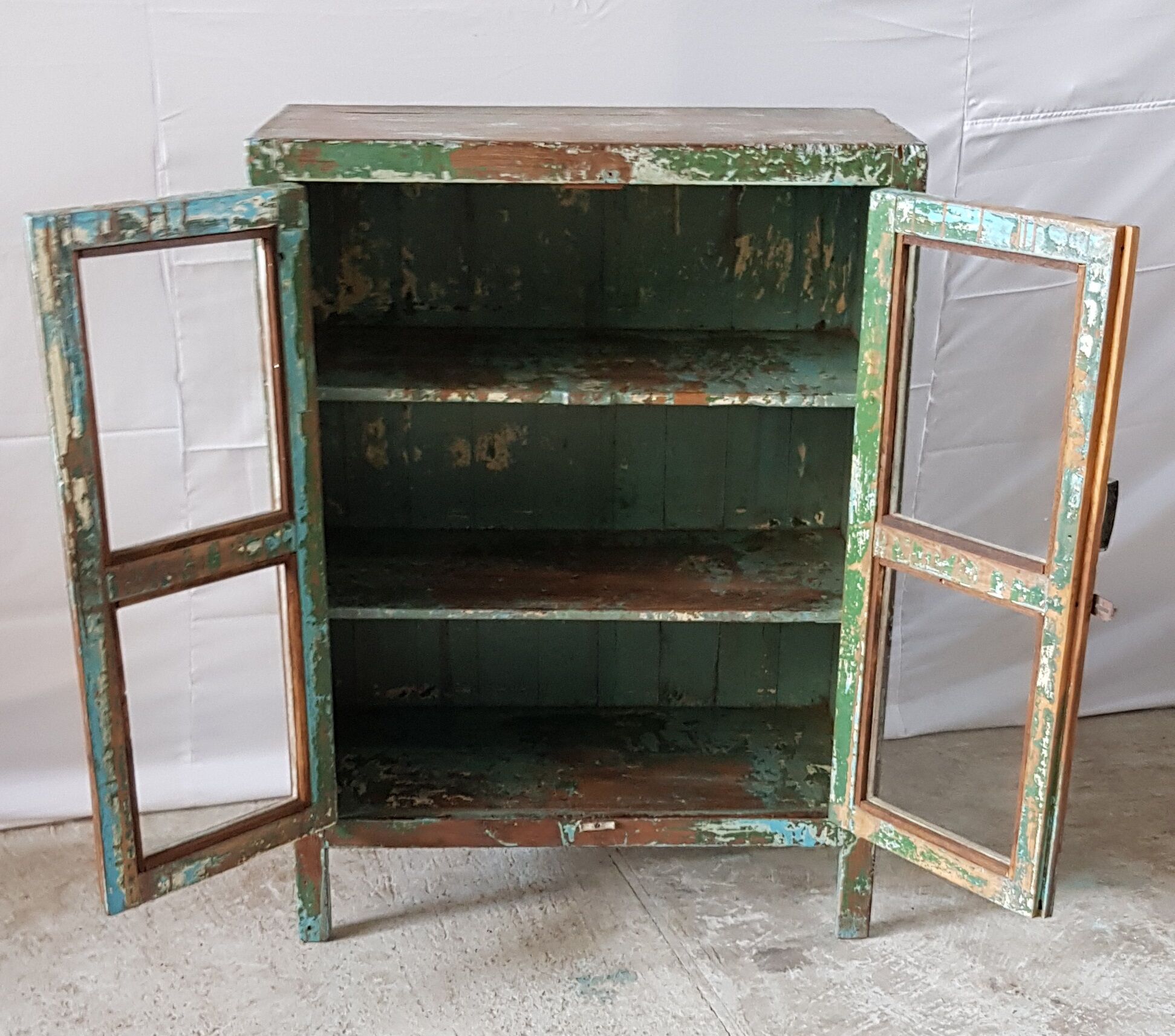 Former teak cabinet with its original green patina