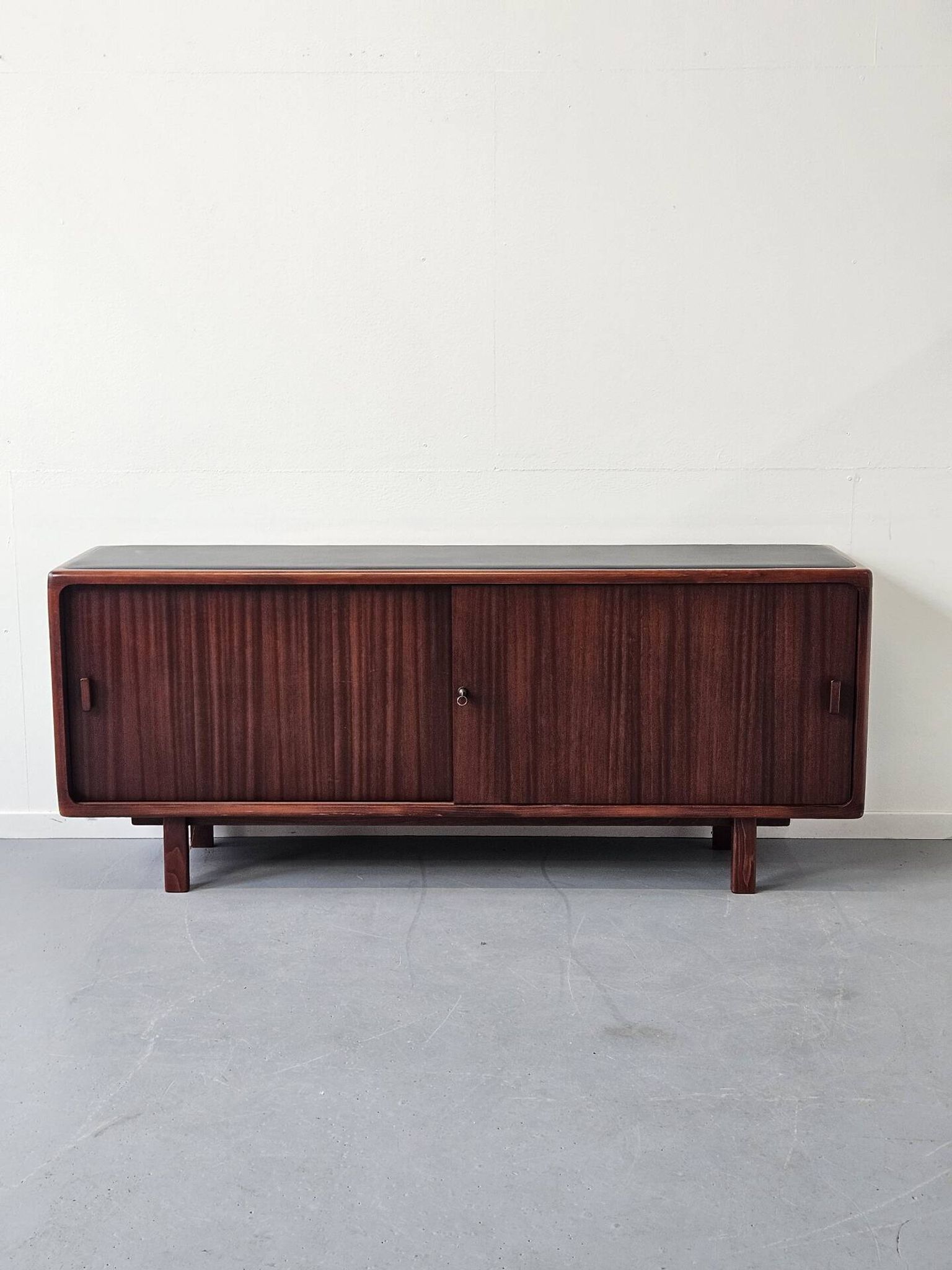 Vintage enfilade in teak and leather, 1970s.