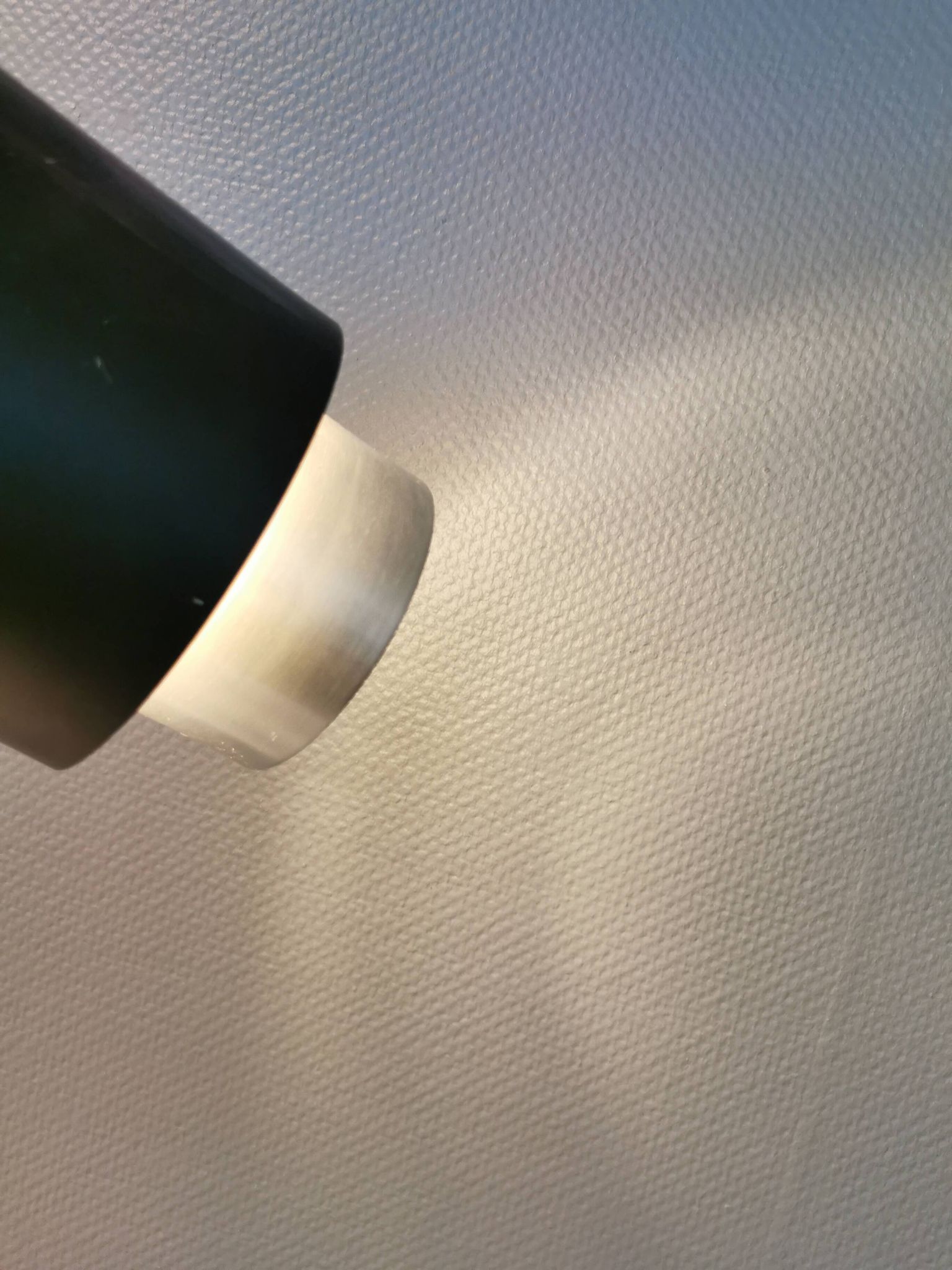 A set of beautiful cylinder shaped hanging lamps in silver color with black "ring" Danish 1970s.