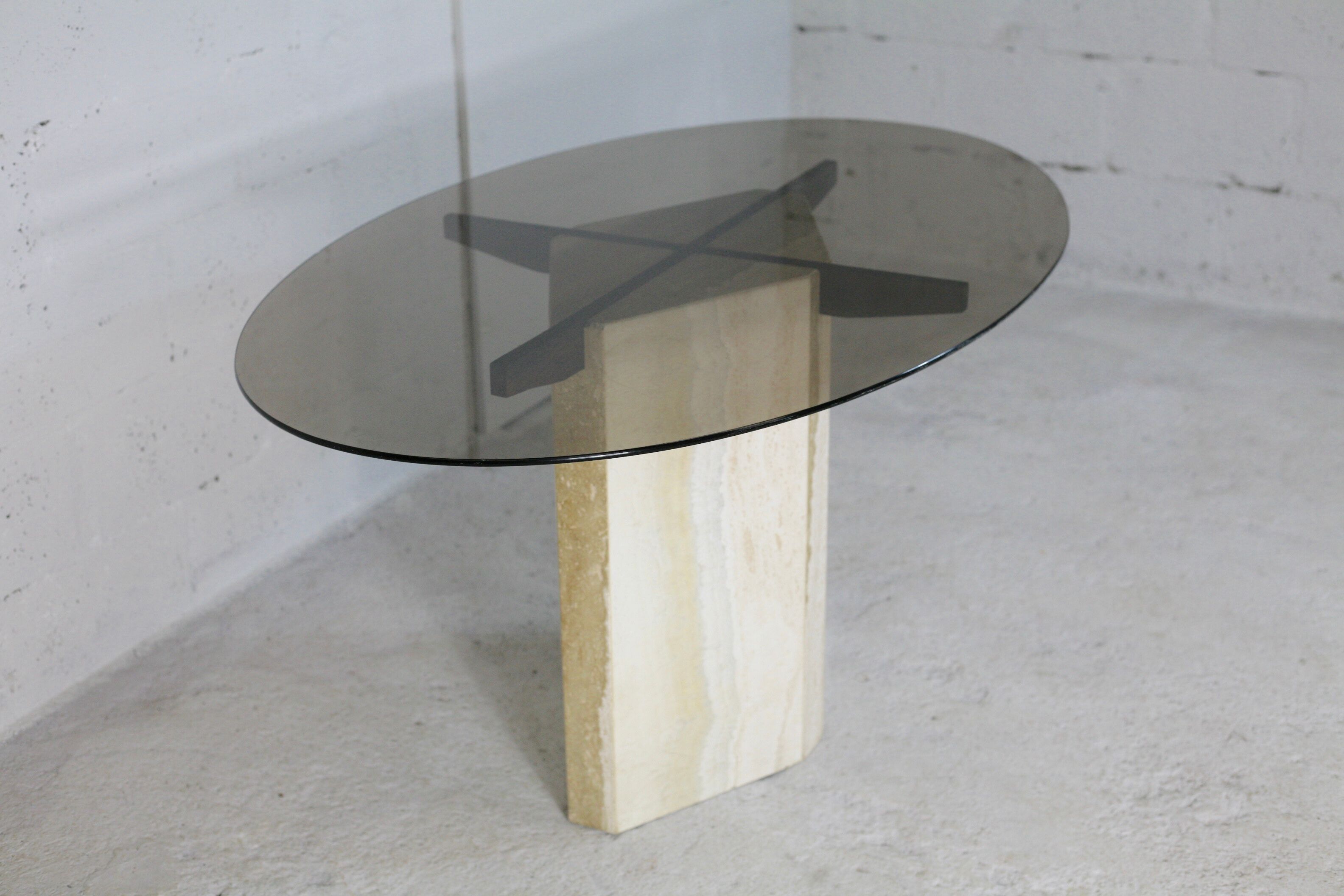 Living table, Comblanchian stone base and elliptical tray in smoked glass, Italy, 1970