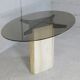 Table de séjour, piètement en pierre et plateau elliptique en verre fumé, Italie, 1970