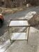 Two-tier side table in Hollywood Regency style with gilded brass and clear glass top, 1960s.