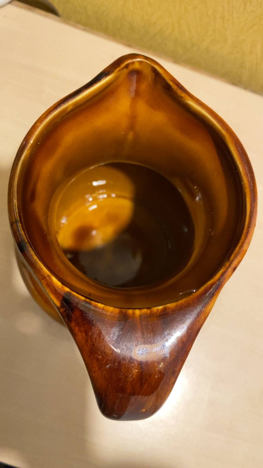 St. Clement brown ceramic pitcher, 1970