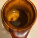 St. Clement brown ceramic pitcher, 1970
