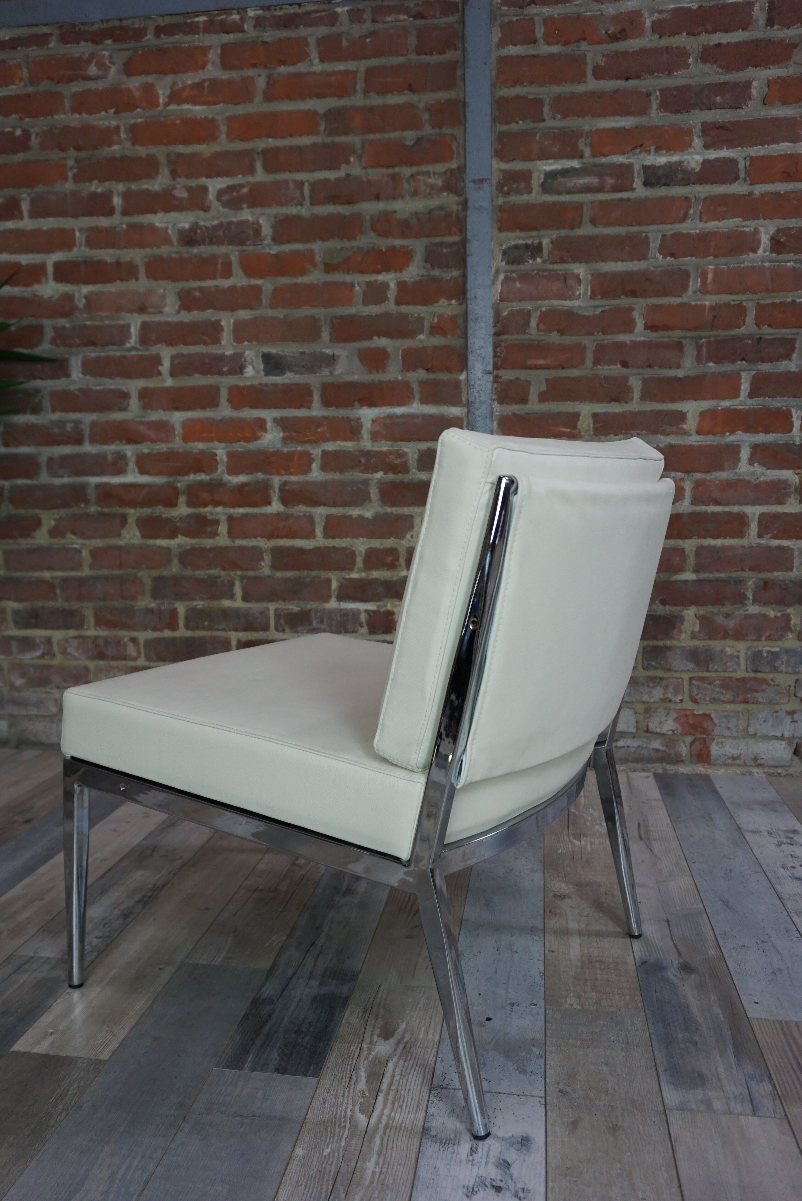 Pair of chrome and leather armchairs