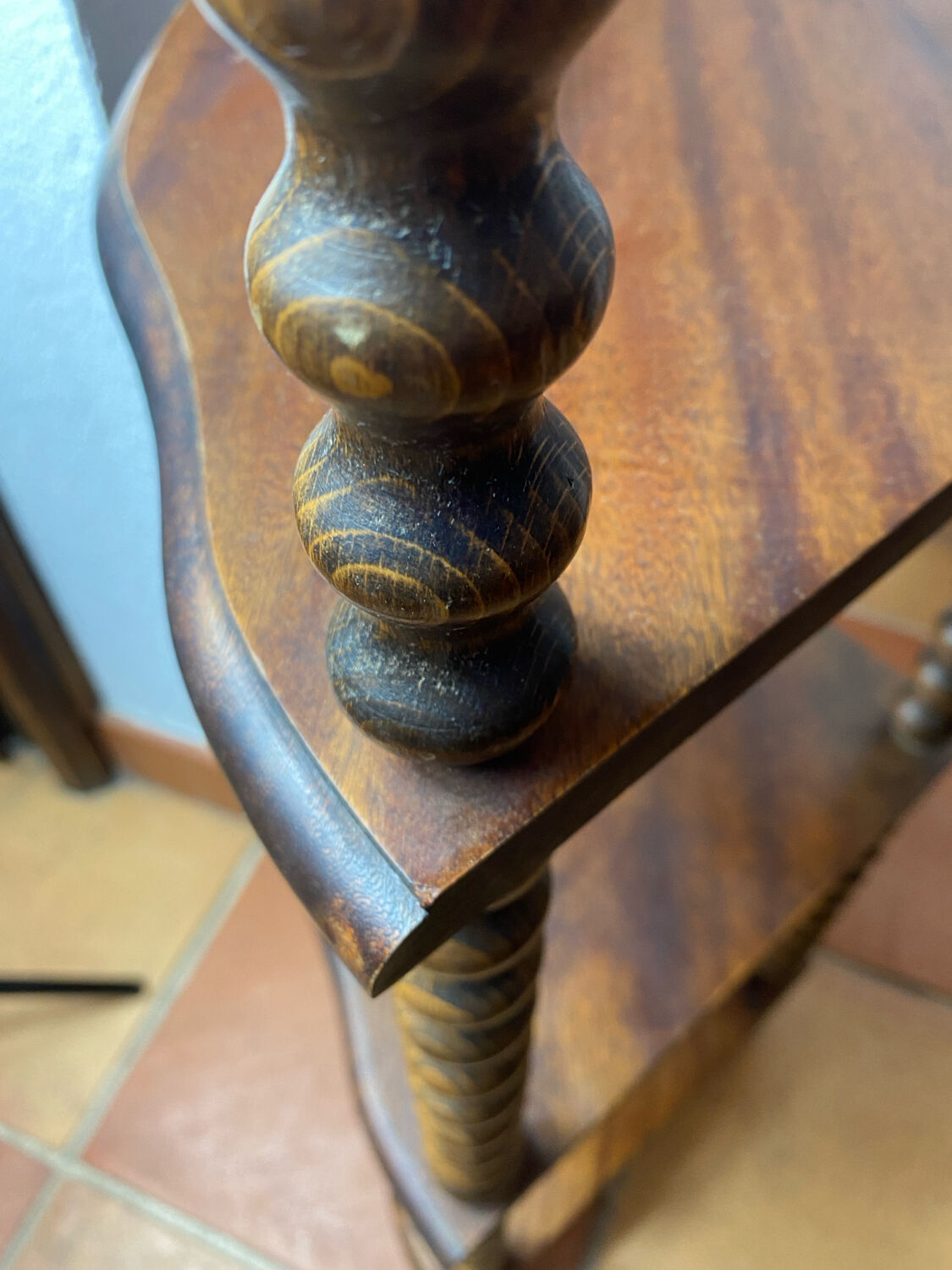 Corner shelf on a turned wooden stand