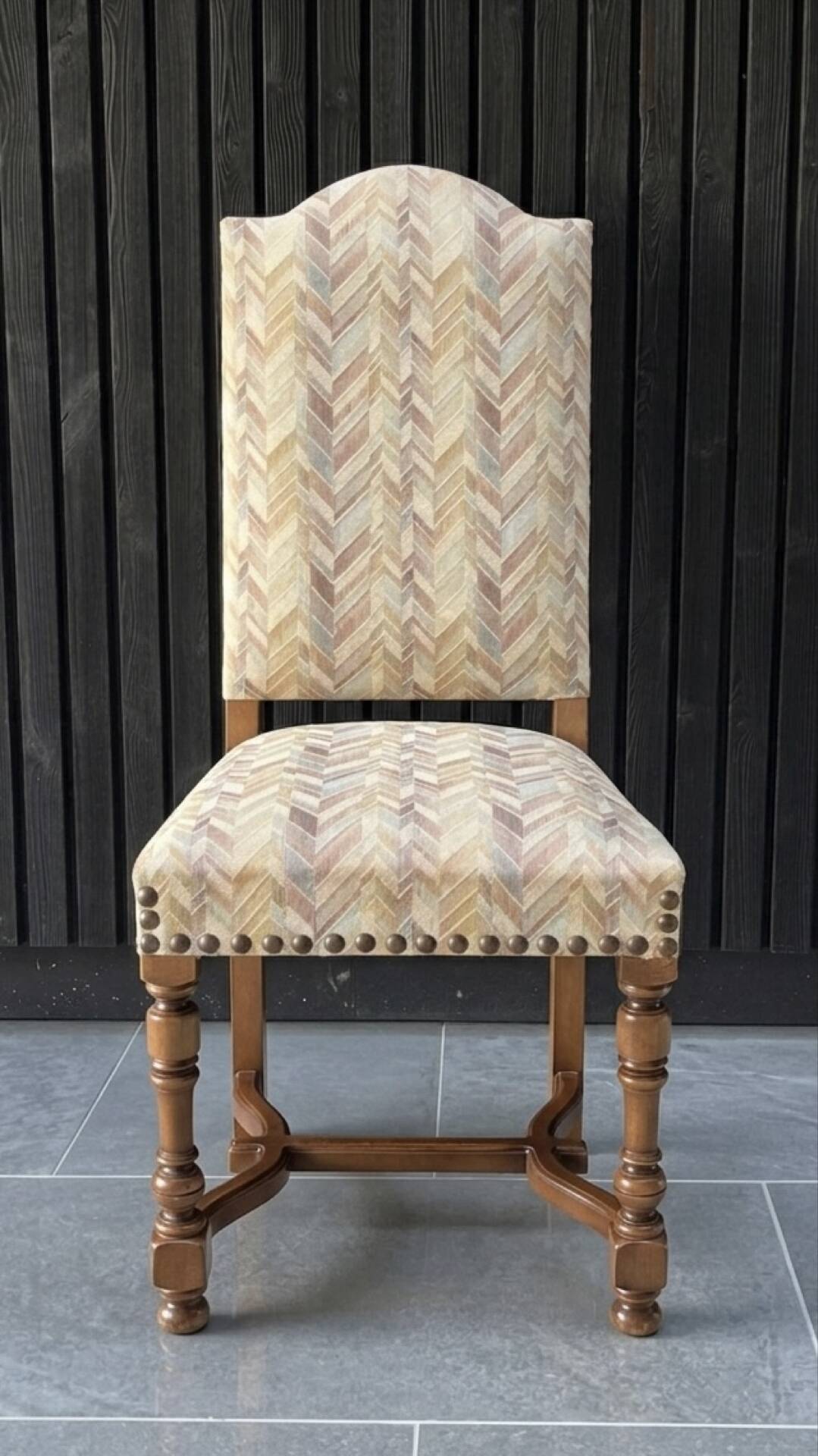 Restored and reupholstered antique chair with character