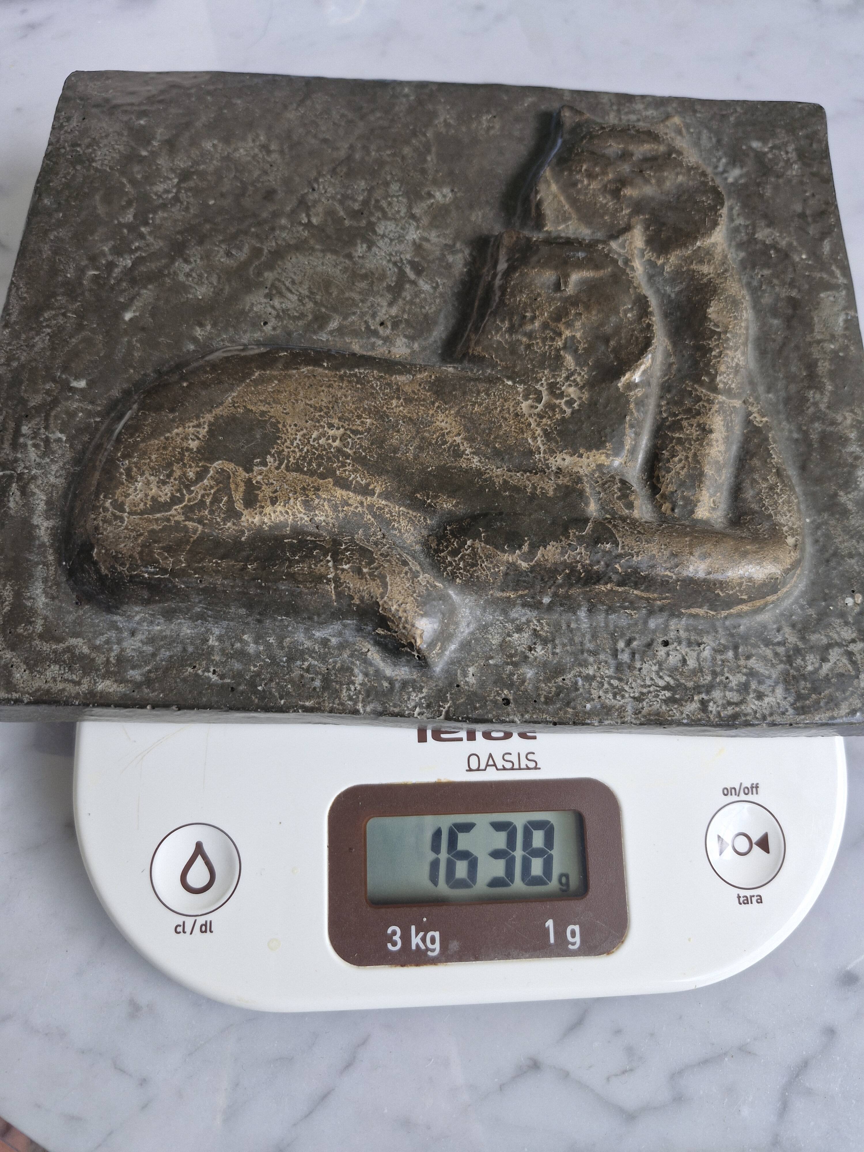 Bas-relief plaque of a rabbit in brown patina, seated cat