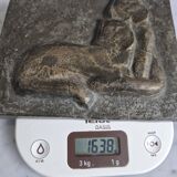 Bas-relief plaque of a rabbit in brown patina, seated cat