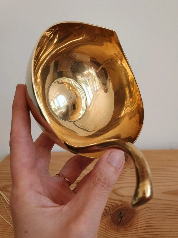 Empty brass apple pocket