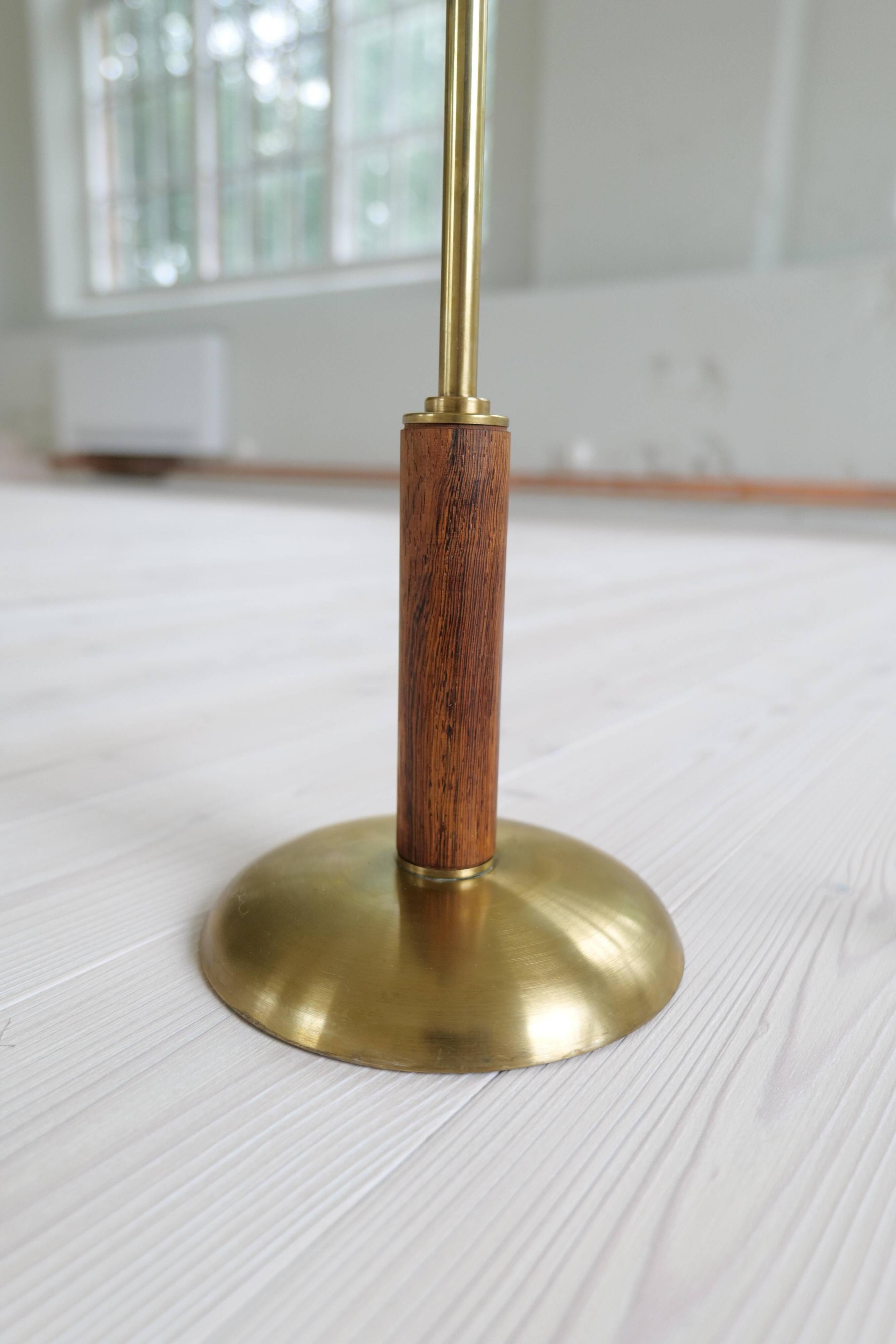 Mid-century modern table lamp in brass and walnut, rare by Einar Bäckström, Sweden.
