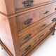 Antique walnut commode with bronze handles in the shape of a lion's mask,