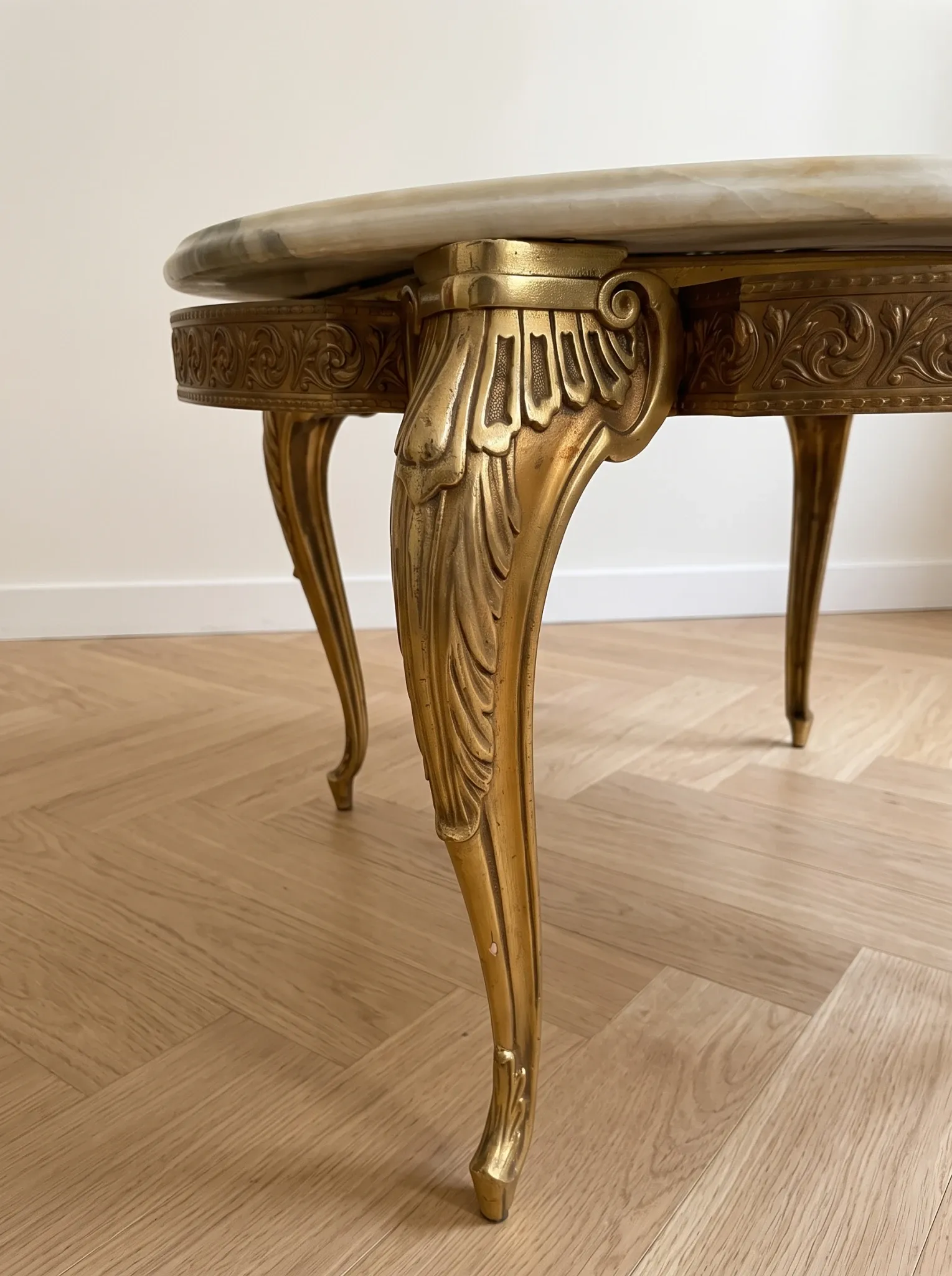 Baroque style coffee table with marble and gilded wood.