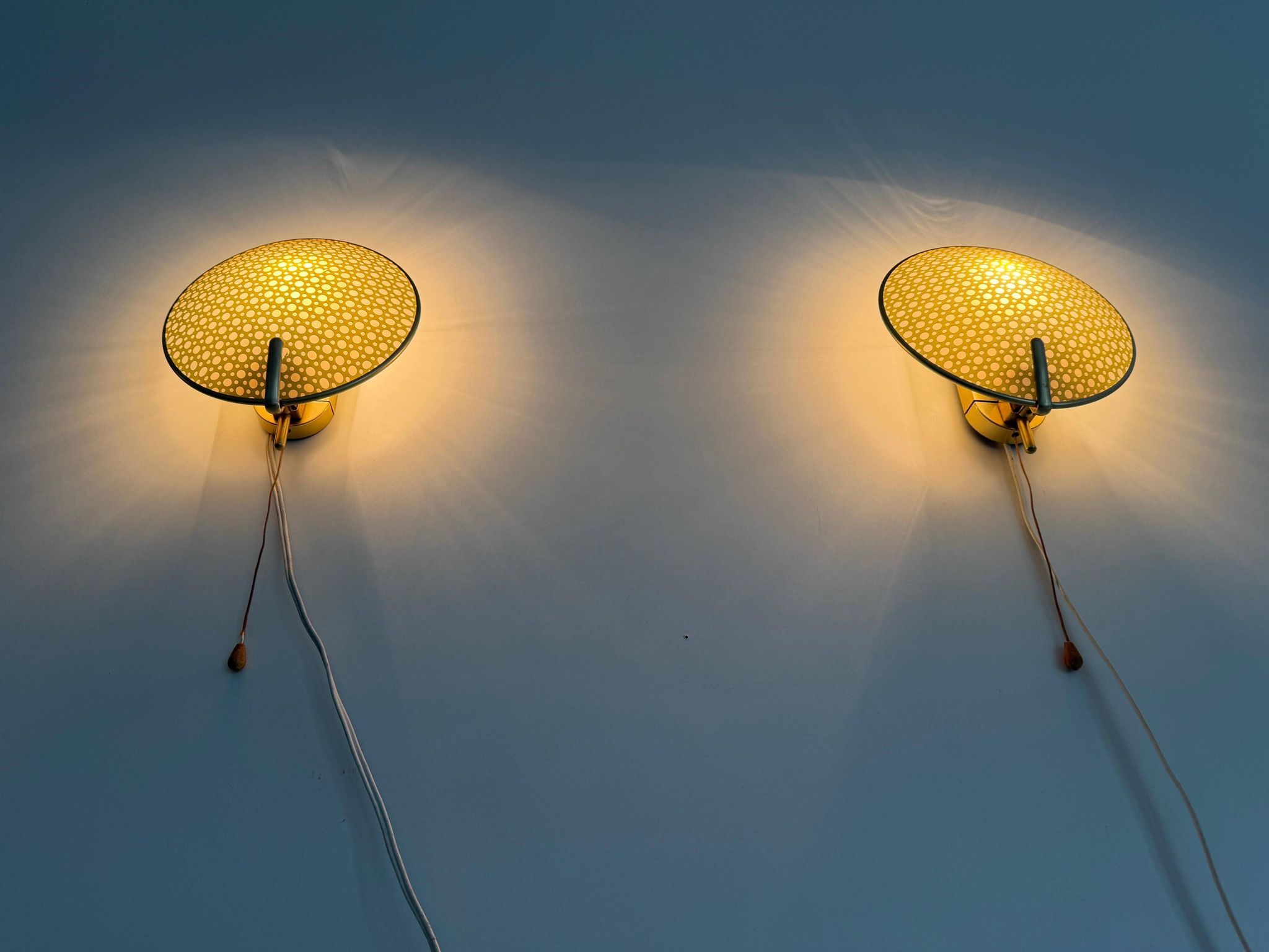 Pair of green plexiglass and gold metal wall lights by Erco, 1950s, Germany.