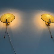 Pair of green plexiglass and gold metal wall lights by Erco, 1950s, Germany.