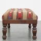 Oriental pouf upholstered in an antique kilim
