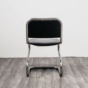 Ensemble de 4 chaises à bascule en acier chromé design années 80 vintage moderne.