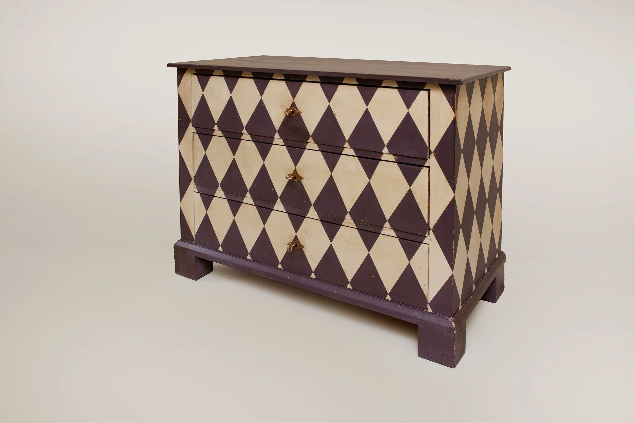 Pine chest of drawers from the 1940s with recent decorative paint.