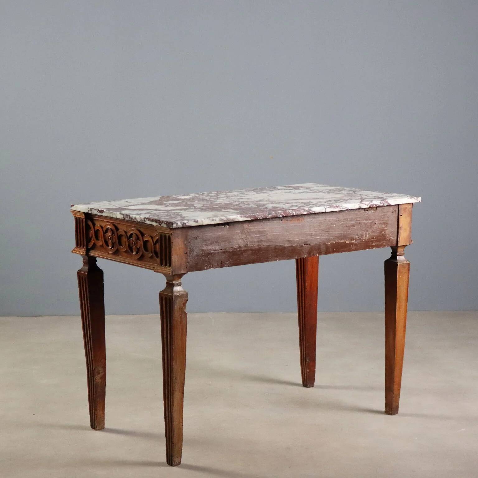 Antique neoclassical console in walnut with a marble top, 18th century.