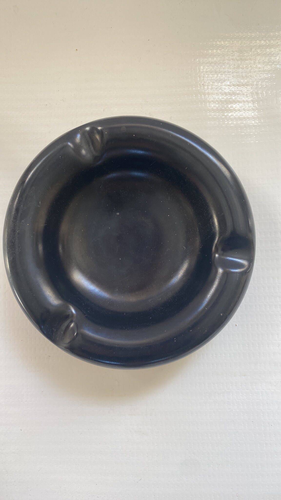 Black ceramic ashtray from the 1950s
