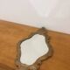Bakelite scrolled mirror with rocaille pediment