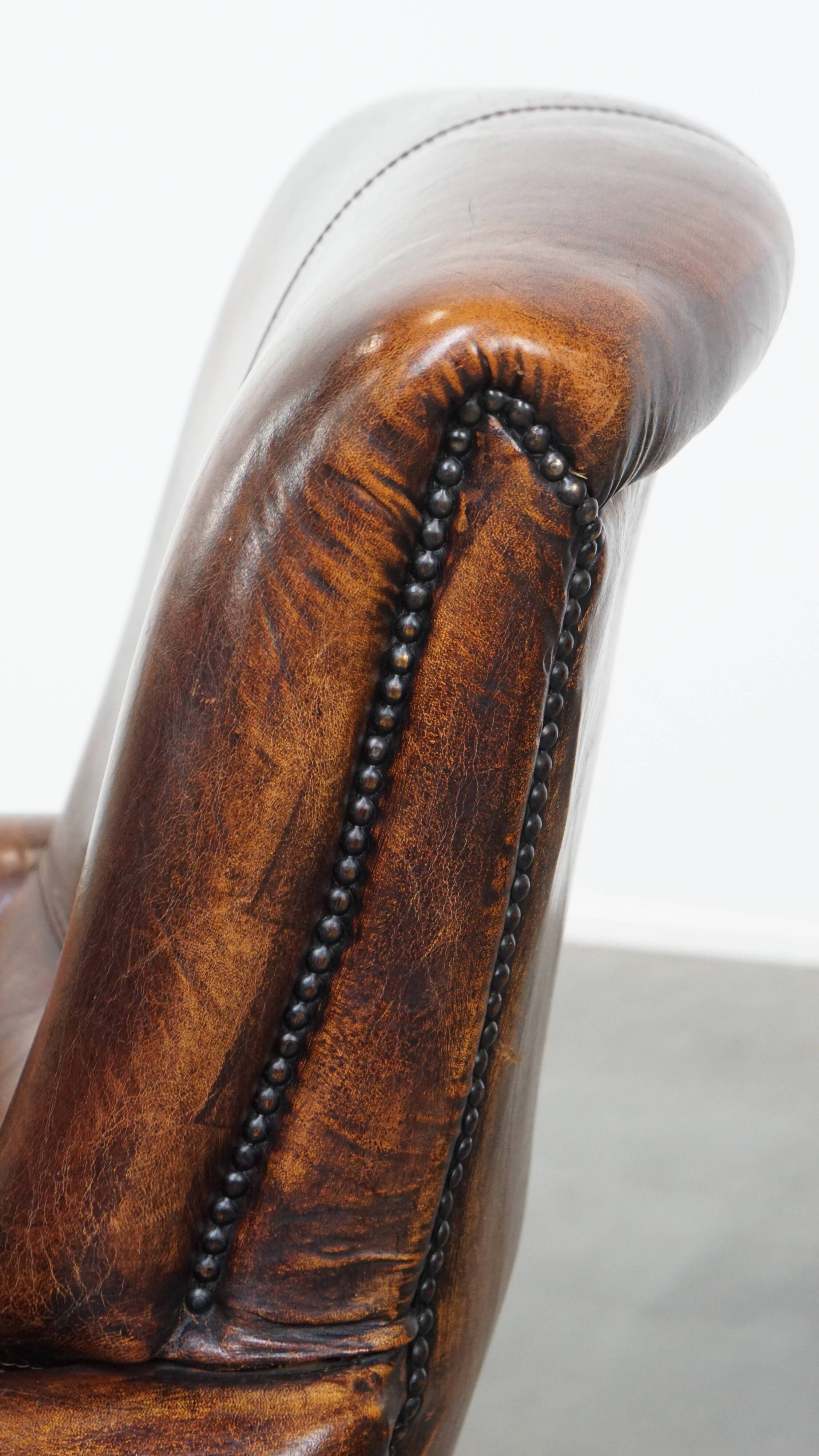 Fauteuil vintage en cuir de mouton avec dossier haut
