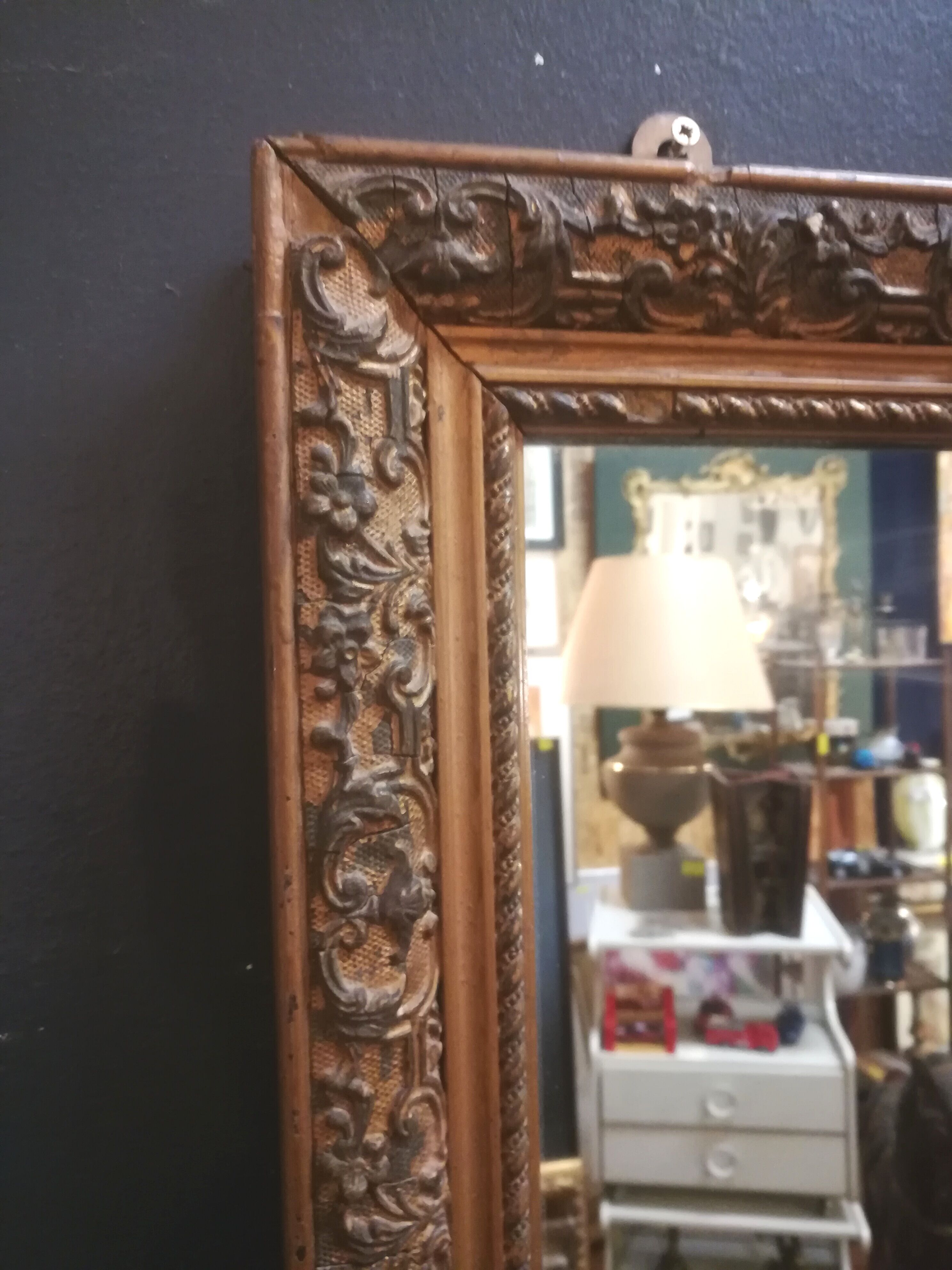 High and narrow mirror in gilded stucco late nineteenth century