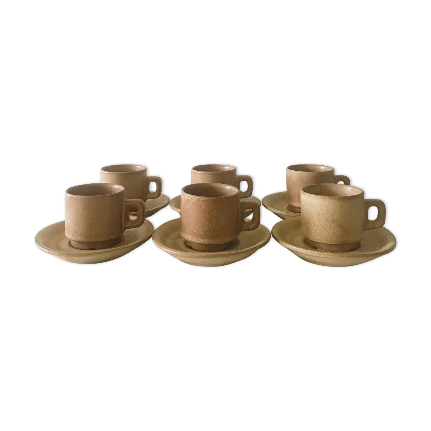 Stoneware coffee cups with saucers