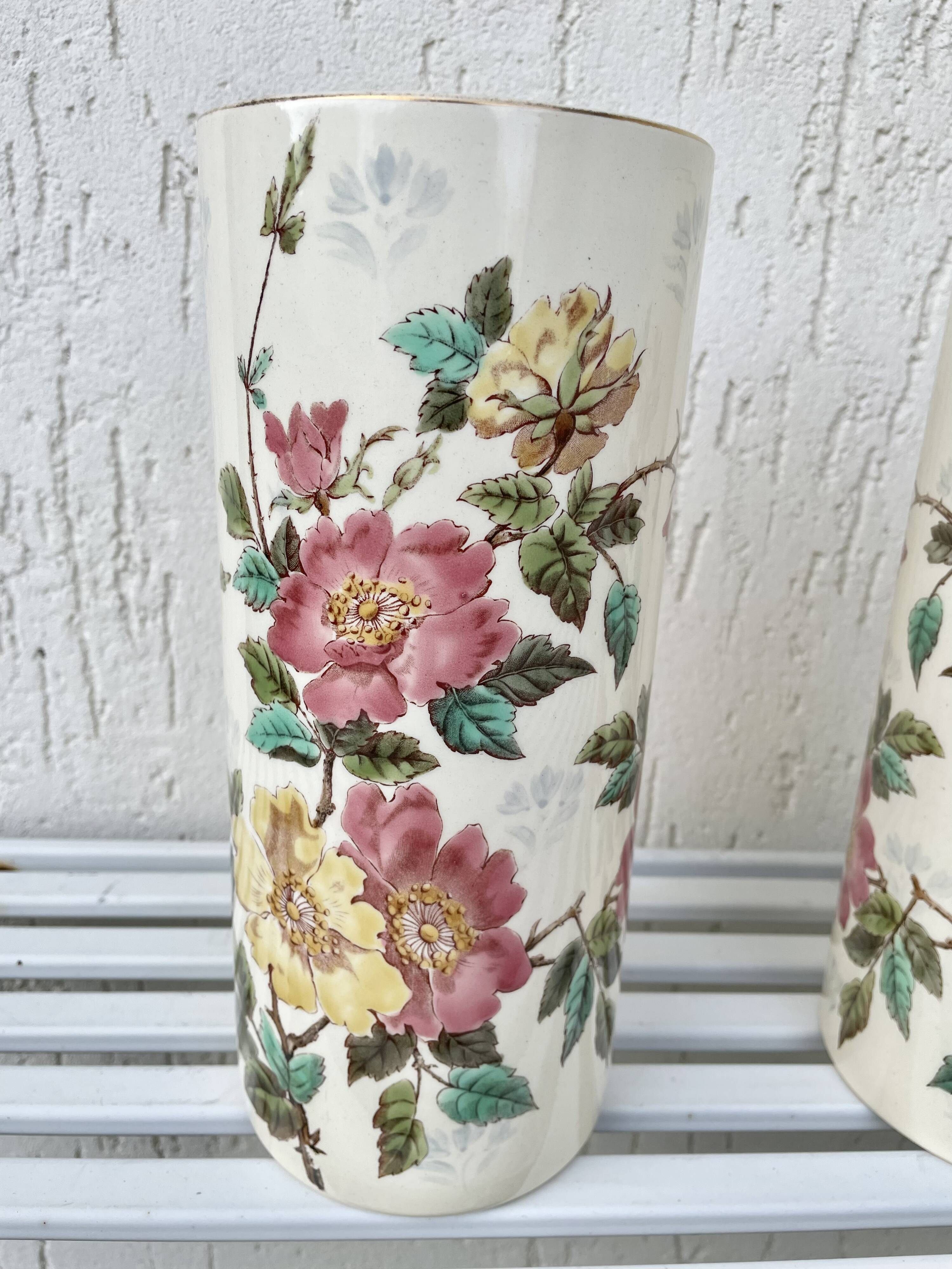 Roller vases in earthenware with floral decoration of wild rose, circa 1930–1950.