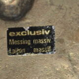 Empty-pocket flower in solid brass