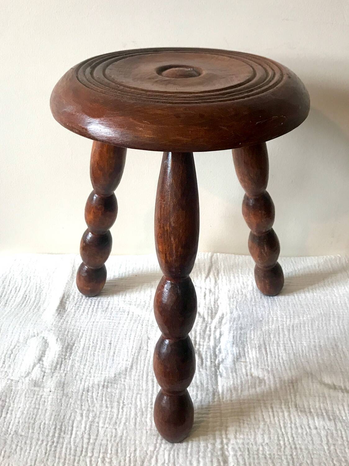 Tripod stool with coil legs