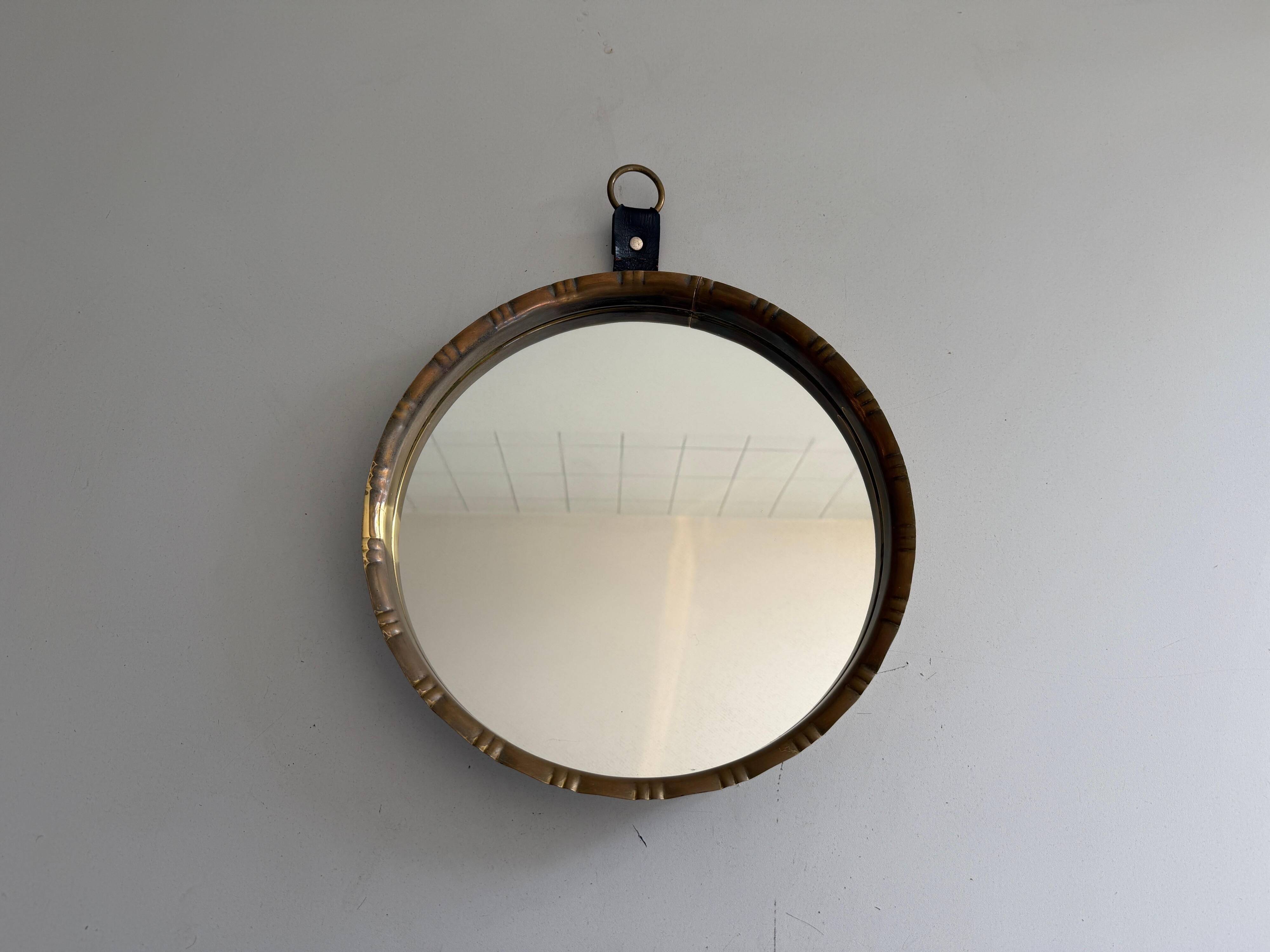 Round wall mirror with brass frame and leather hanger, 1960, Germany