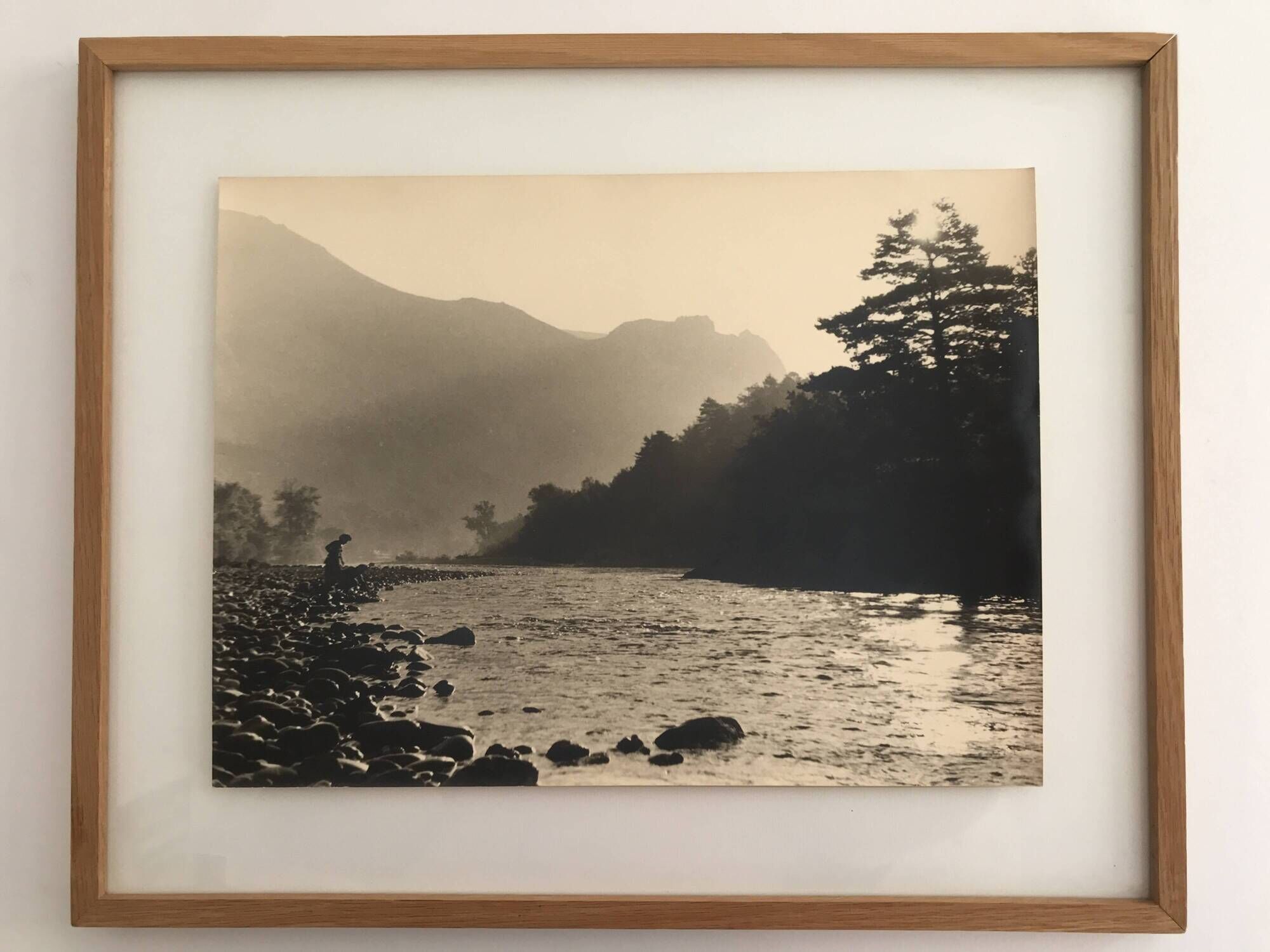 River landscape with characters, 60s/70s. Black and white silver print.