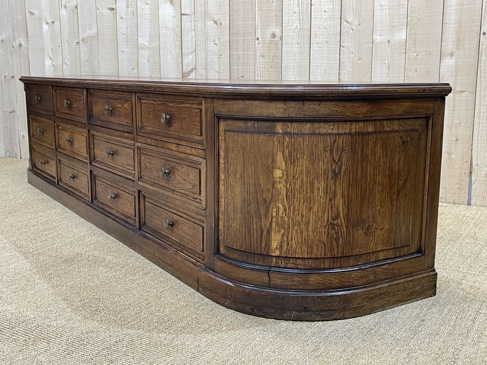 Long low oak countertop with 12 drawers - early XXth