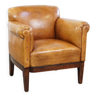 Restored antique Art Deco sheep leather armchair